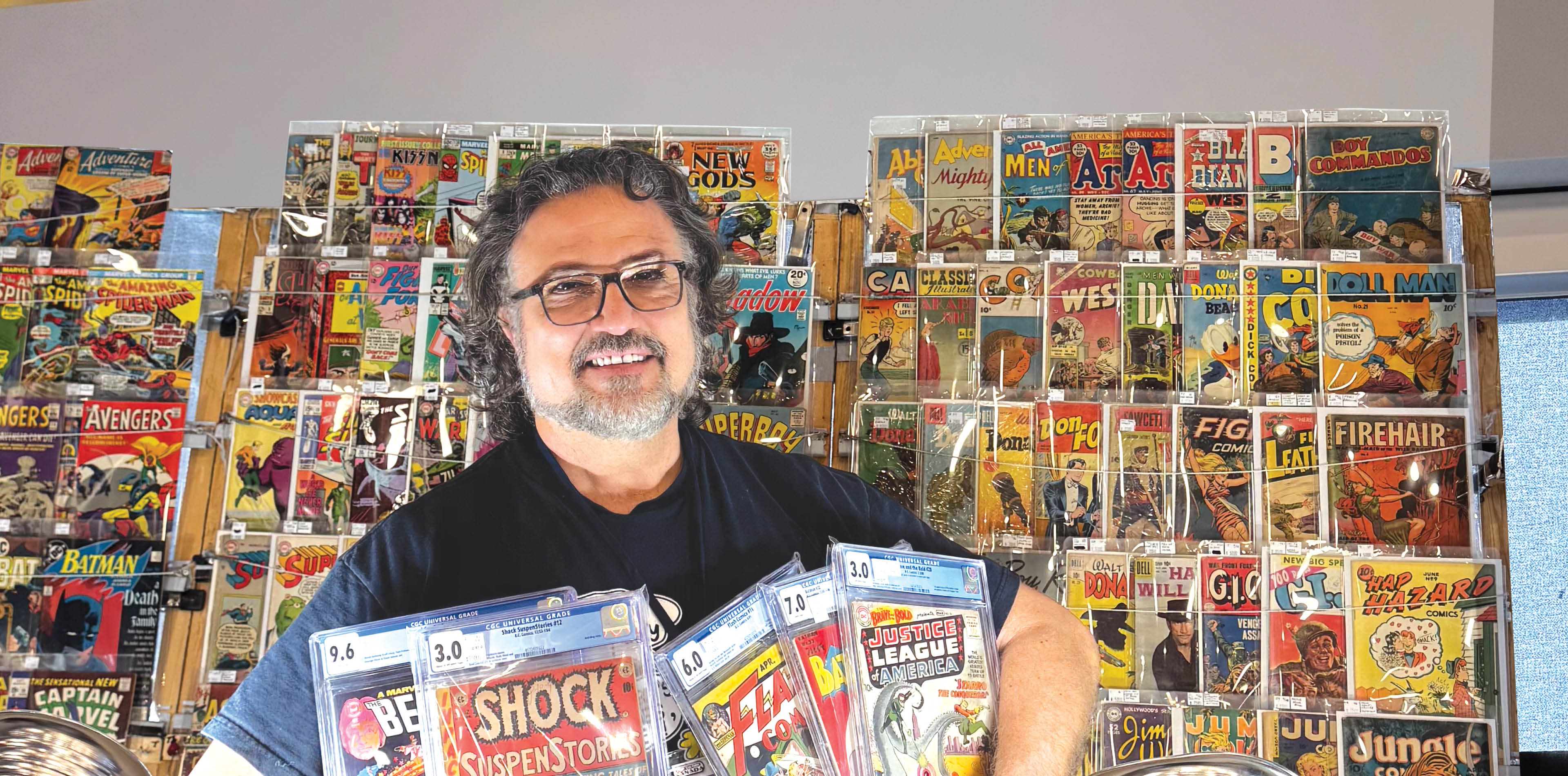 A man is holding three comic books in his hands. AI generated content