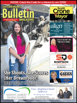 A woman is standing in front of a statue and posing for a photo. The image is featured in a magazine. AI generated content